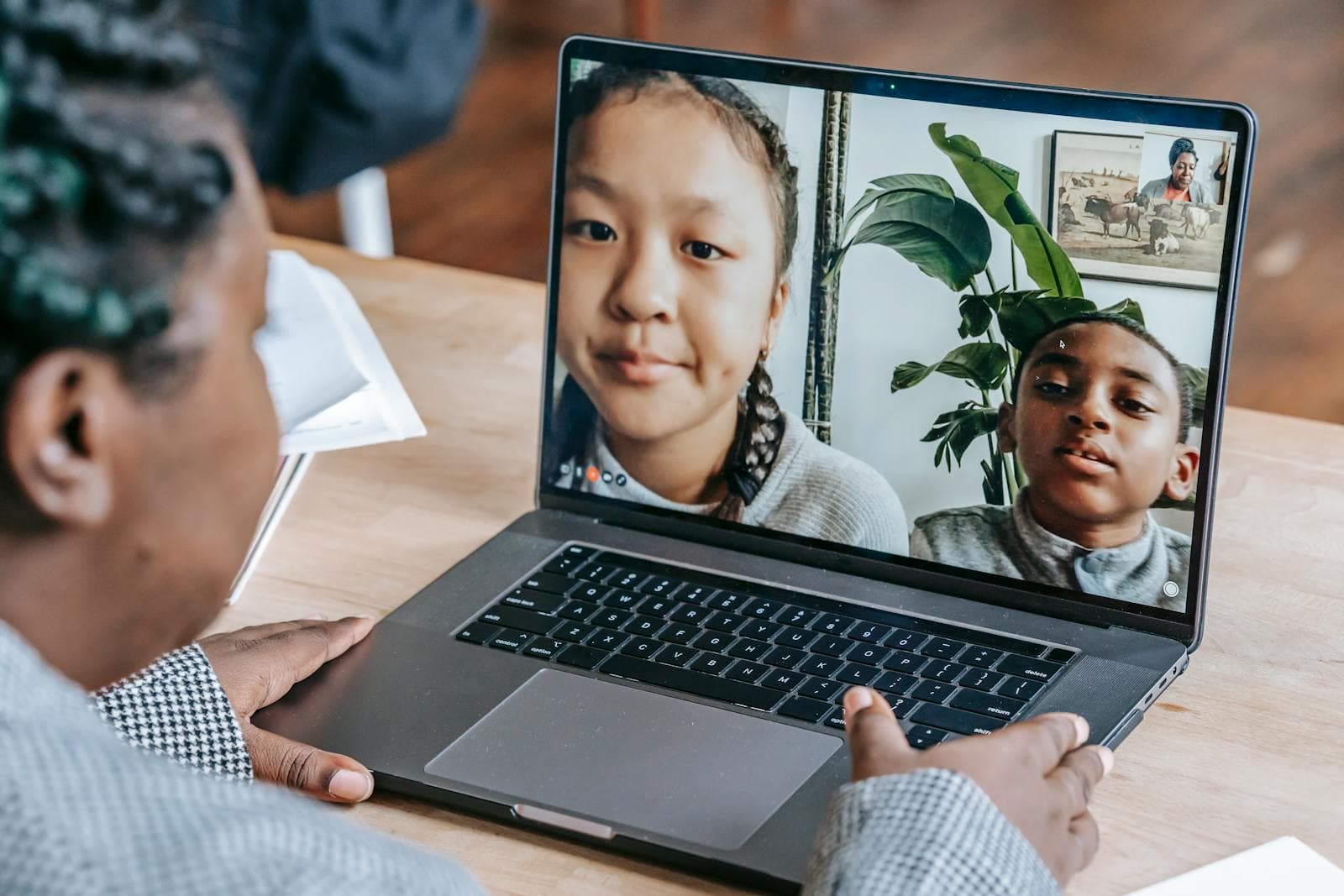 Instructor leading an online learning session on a laptop
